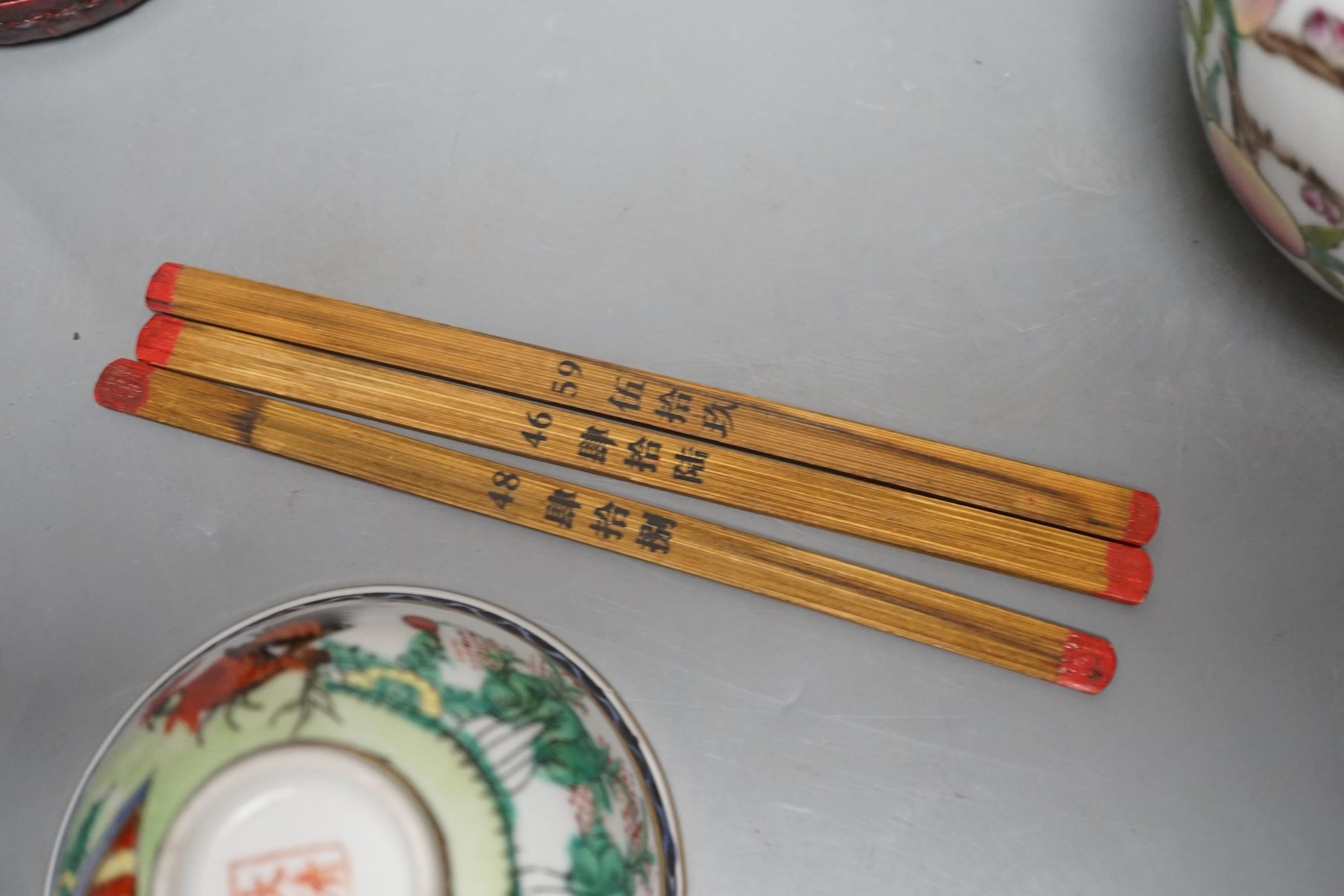 A pair of Chinese famille rose ‘peach’ bottle vases, 17cm, a ‘phoenix’ jar and cover, two porcelain cups and a boxed set of bamboo tallies or counters (6)